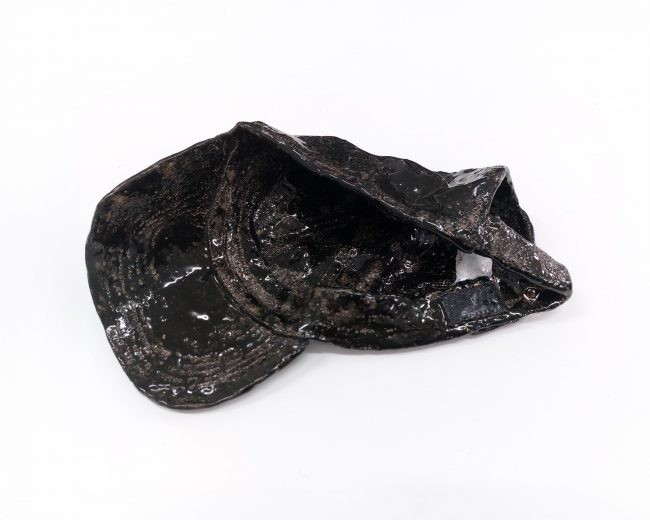 Schwarze Cap (2), 2026, glazed ceramic, 8 x 26 x 19 cm
